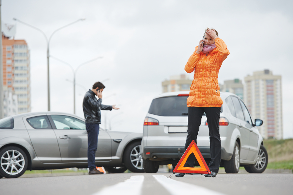 How To Take Care Of Your Mental Health After A Car Accident - Car collision. driver man and woman examining damaged automobile cars after crash accident in city