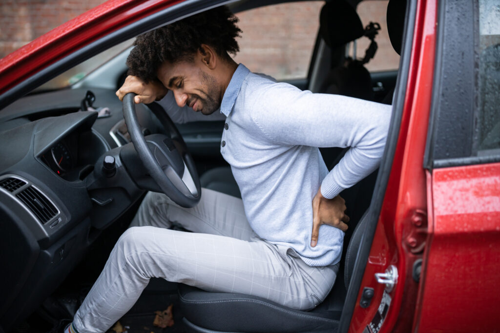 Contributing Factors In Car Accidents Cases - Driver Standing Having Backpain