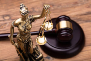 Why It’s Wise To Hire A Wrongful Death Attorney - Statue Of Justice With Brown Gavel